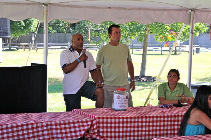 Local 94 union family picnic with inflatables and a crowd