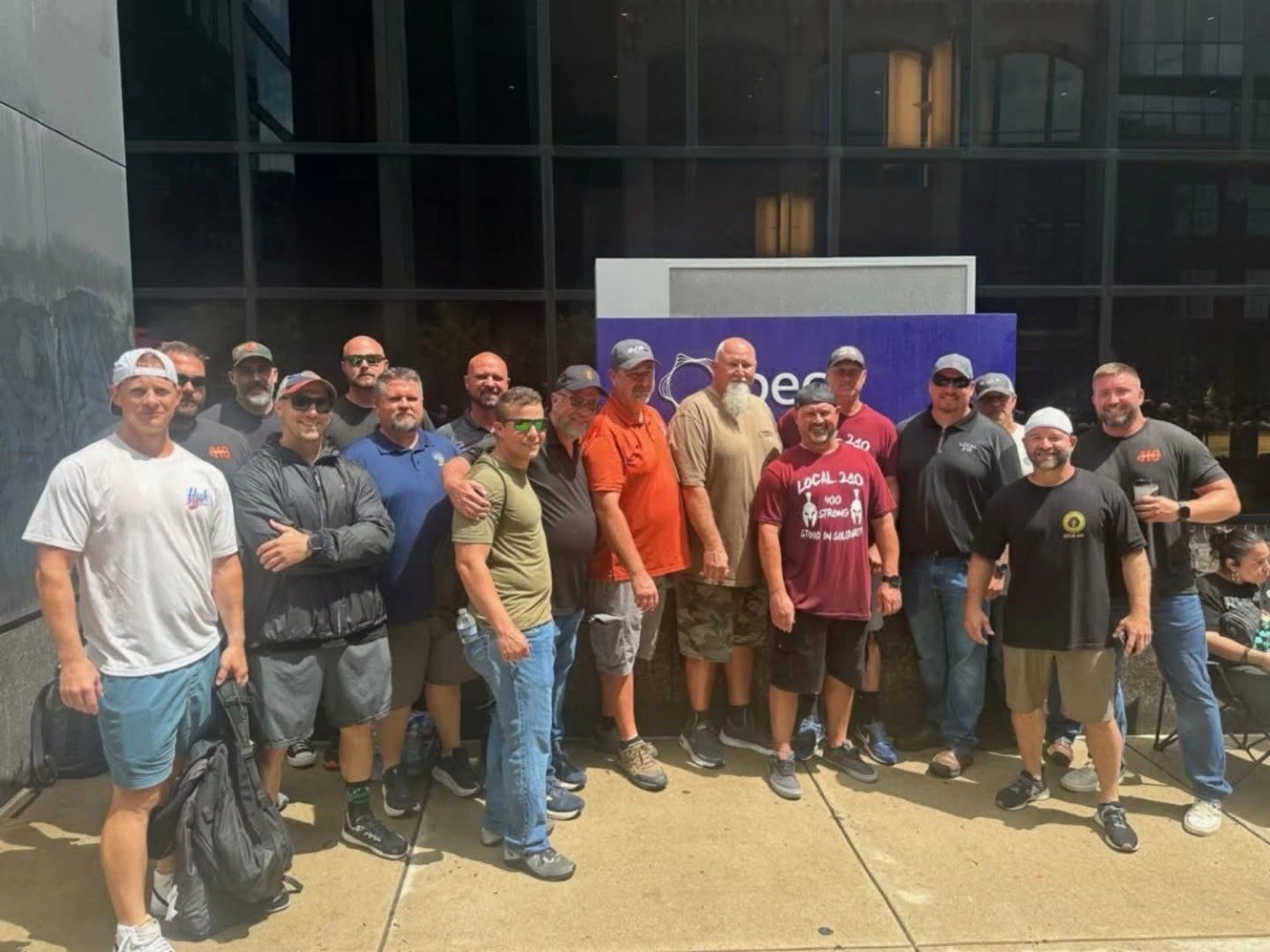 Union members standing together outside a PSEG building